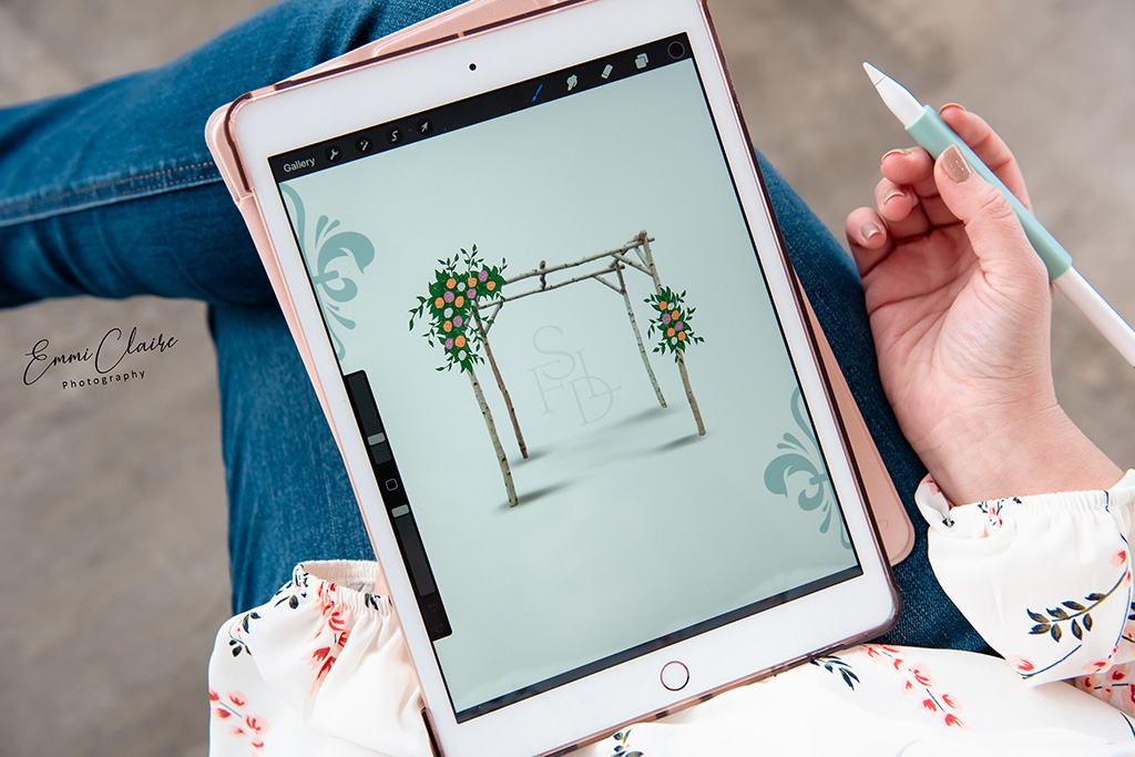 photo of a woman sketching a concept on her iPad to help her prepare for her branding photography session