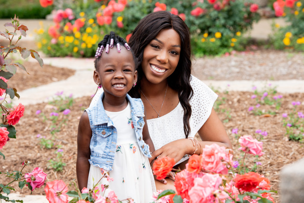 Mother and daughter pose together in a garden at Maymont park during one of their photoshoots in RVA