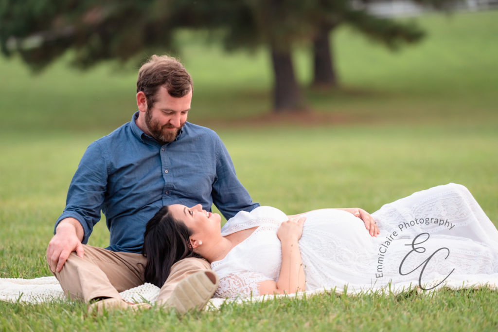 a couple who are my clients practicing the tips I shared on staying comfortable during your maternity session