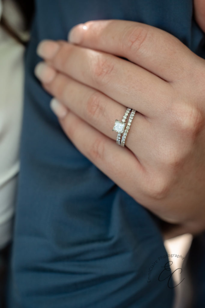 detail shot of a bride's wedding band and engagement ring after she and her husband have said their I do's.