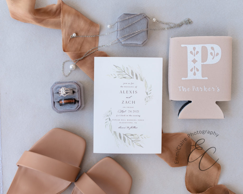 wedding details of the bride and groom for their pastoral wedding including invitations, rings, shoes, and jewelry