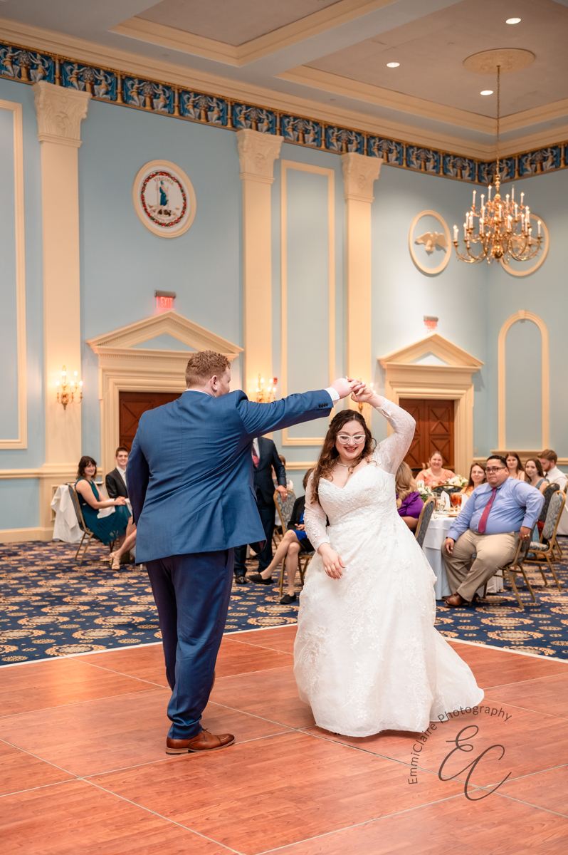 The bride and groomm share their first dance to an instrumental version of Tale as Old As Time at The David Student Union Ballroom at Christopher Newport University in Newport News, VA.