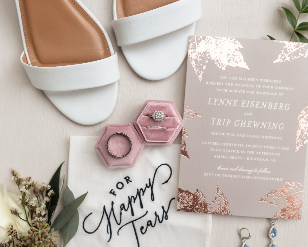 A photo of Lynne's wedding details including her rings, invitation, and shoes