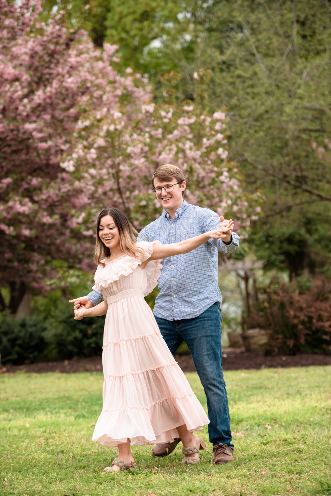 couple dancing and having fun around the flowers