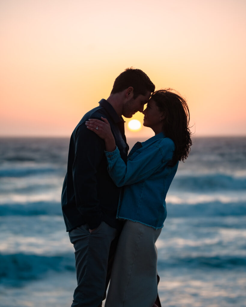 The sun setting over Windansea Beach as Jill and Reece celebrate their engagement