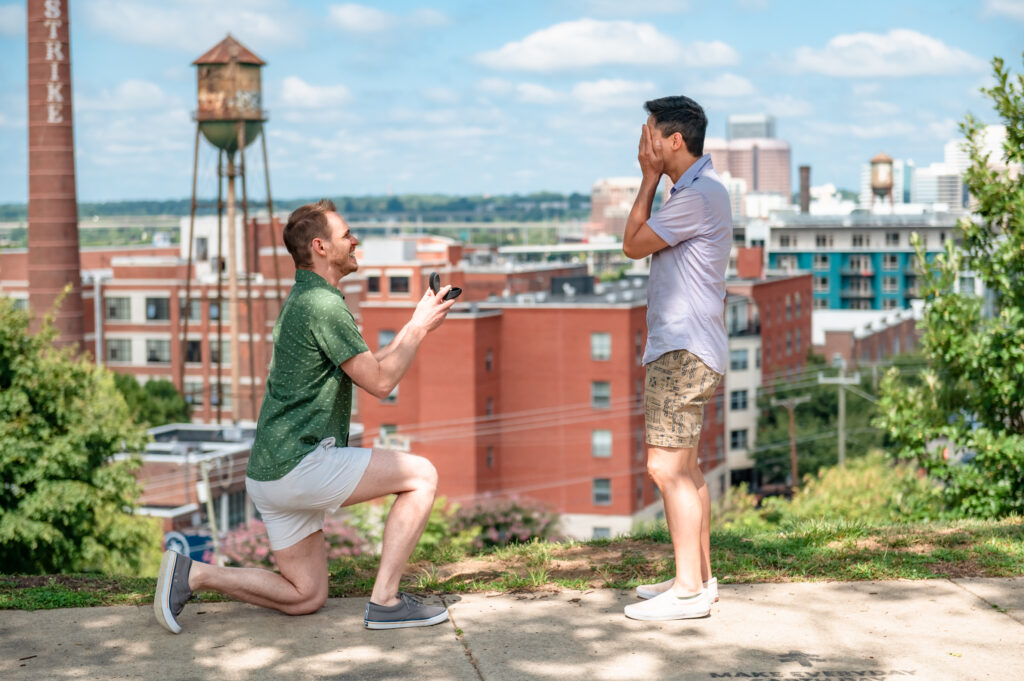 A loving gaze exchanged between the engaged couple amidst the serene surroundings of Libby Hill