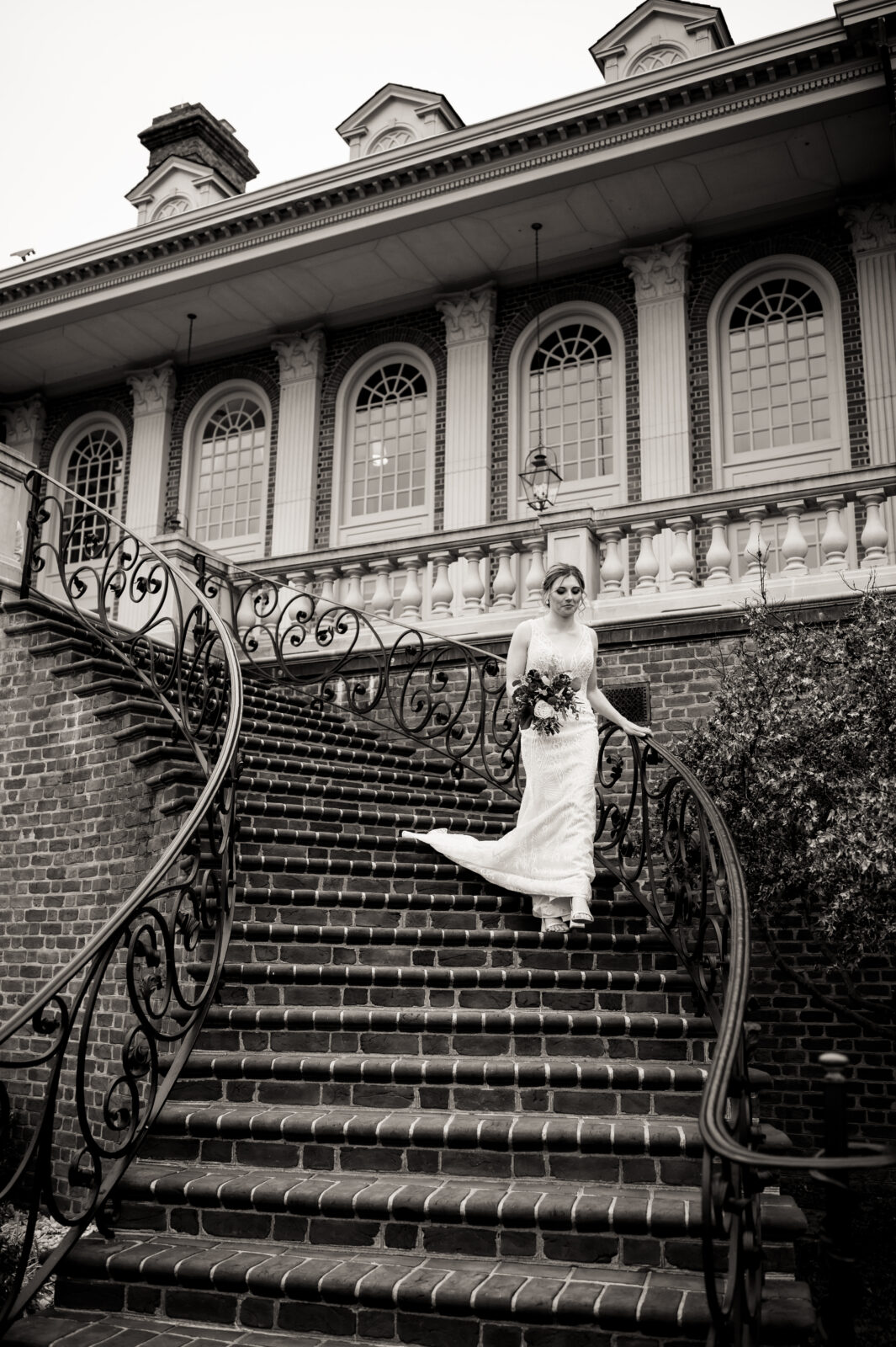 Caroline walking down the staircase to her ceremony