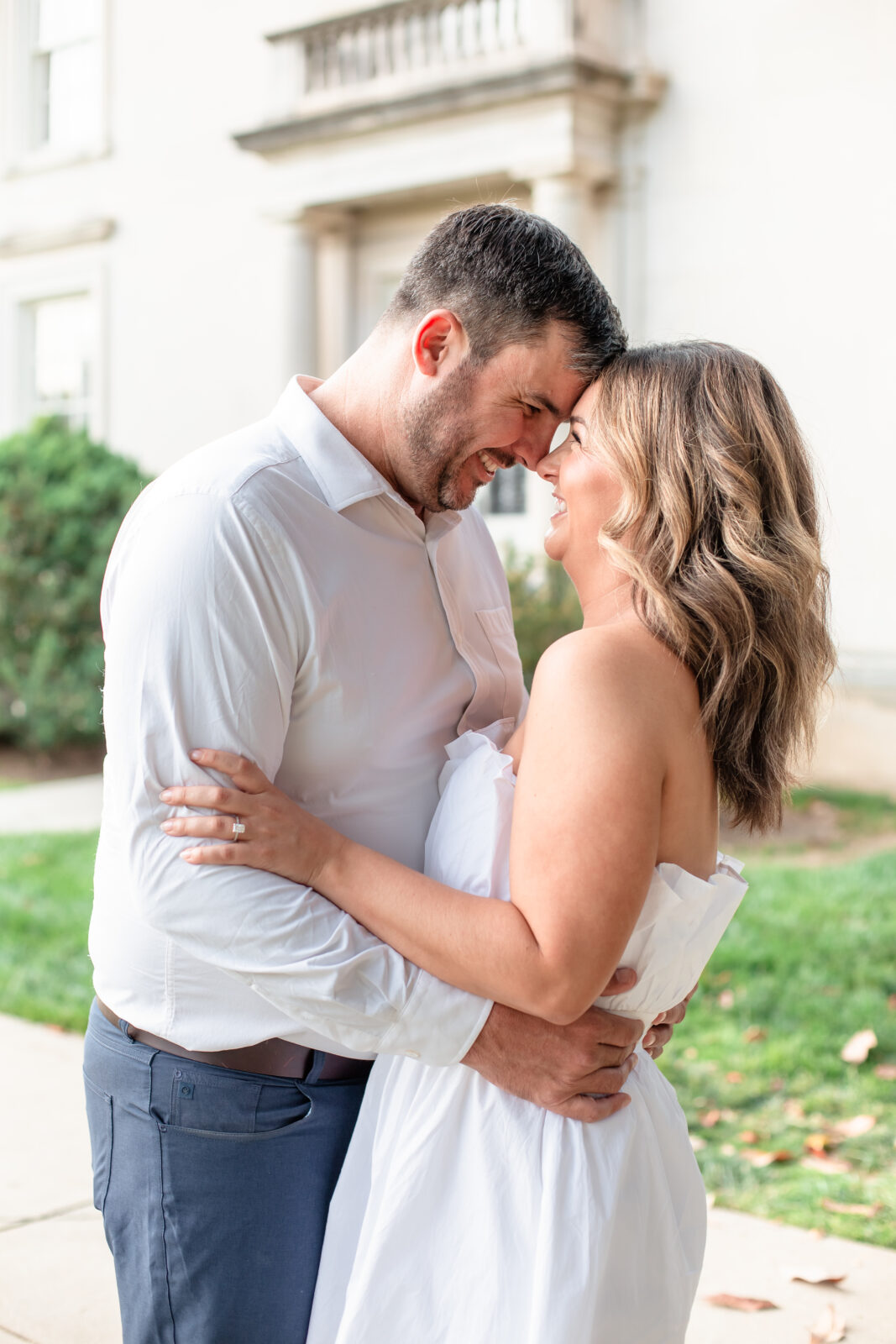 Couple touching foreheads in a loving pose during their engagement shoot.
