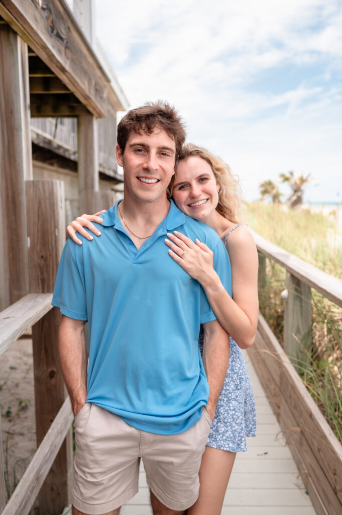 Logan and Chloe's Beach Proposal looking at each other