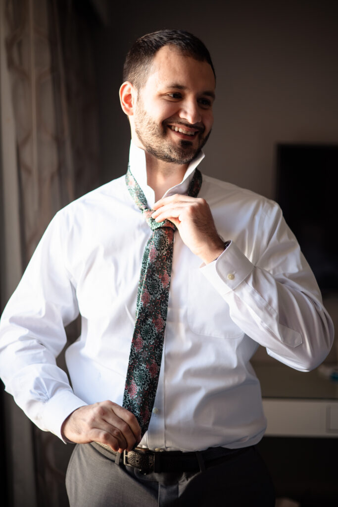 Groom Josh in a Suit Supply suit