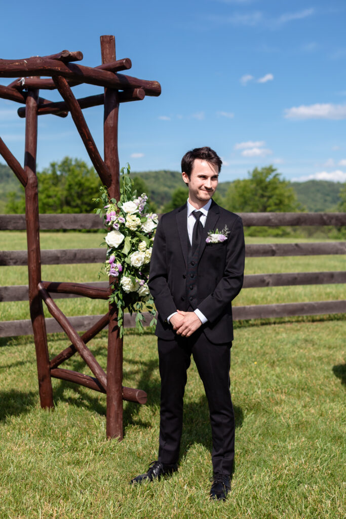 Groom waiting on bride to walk down the aisle.