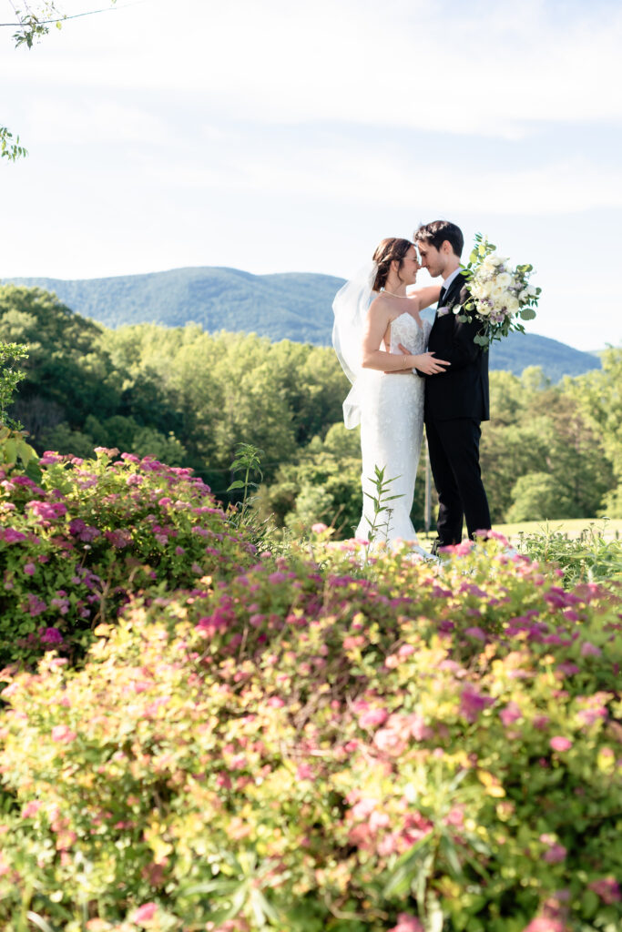 couple embracing during golden hour at mountain wedding venue