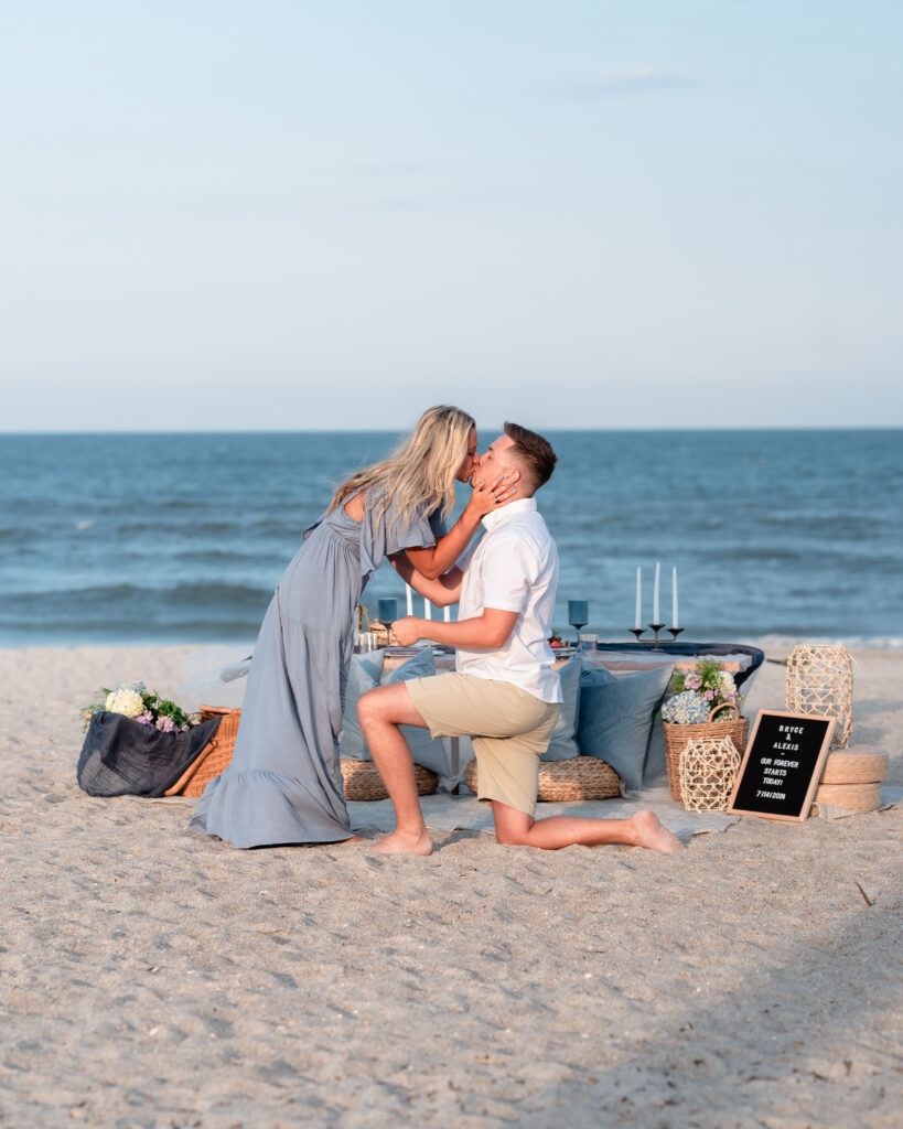 Bryce proposing to Alexis on the beach at Omni Amelia Island Resort with picnic setup