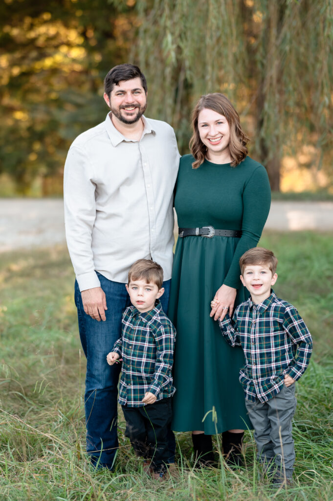 Family laughing together during fall mini session in Richmond with golden leaves