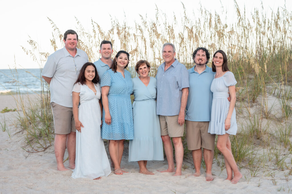 Multi-generational family portrait captured at Omni Amelia Island Resort, with soft golden light at sunset.