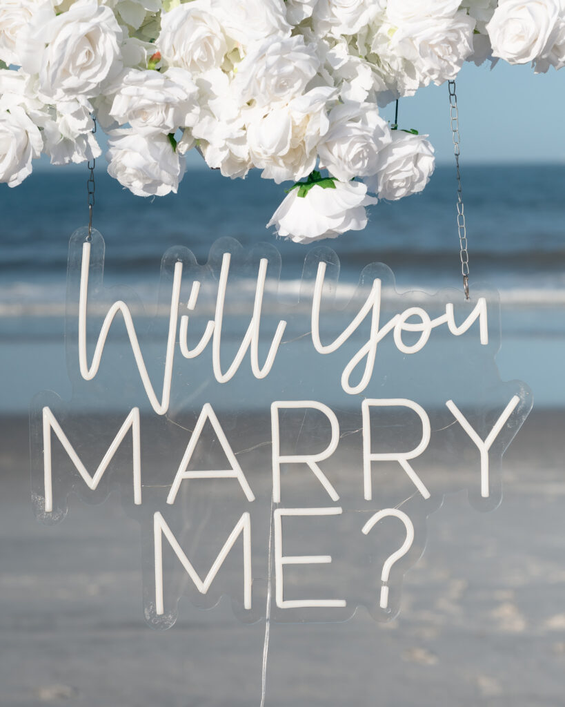 Detail shot of framed photos and candles at Ponte Vedra Beach proposal setup.