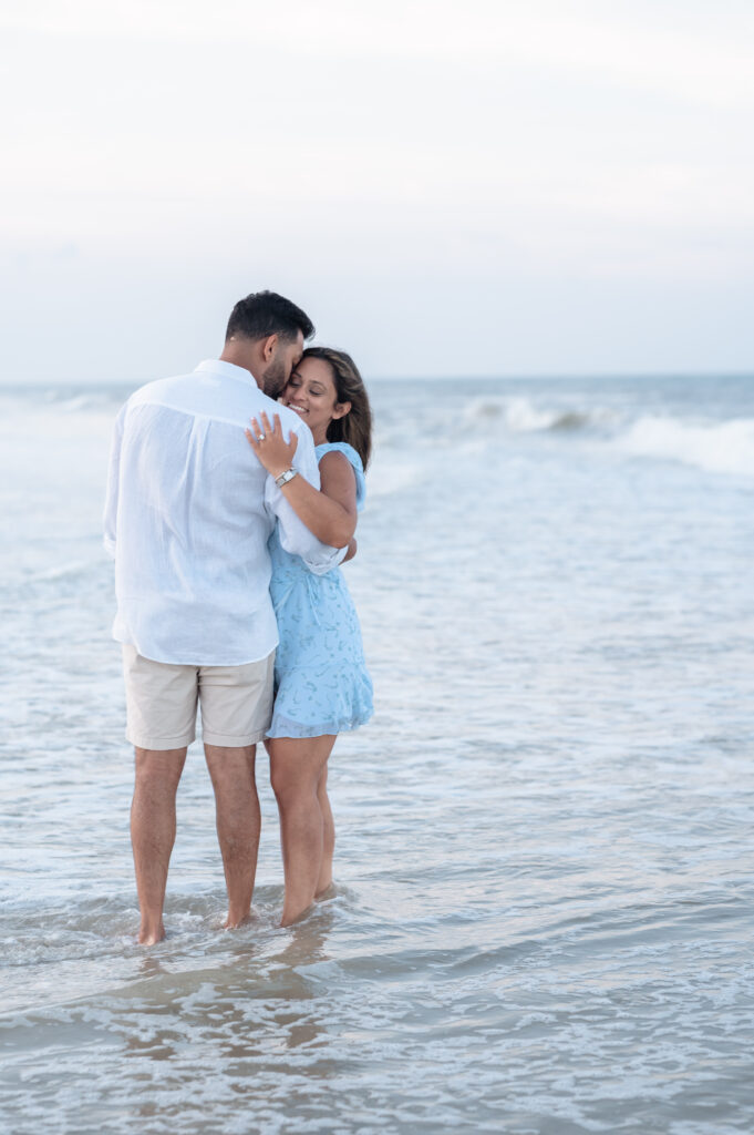 Candid moment of couple walking hand in hand on Ponte Vedra Beach.
