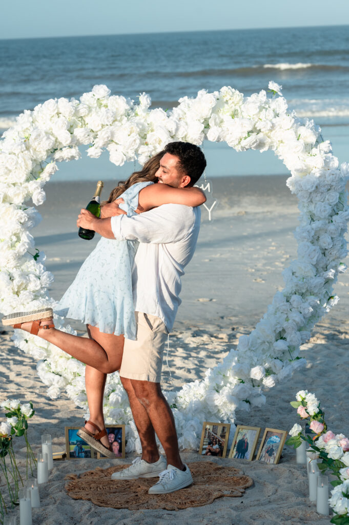Pooja reacting joyfully during Sahil’s Ponte Vedra Beach proposal photography.