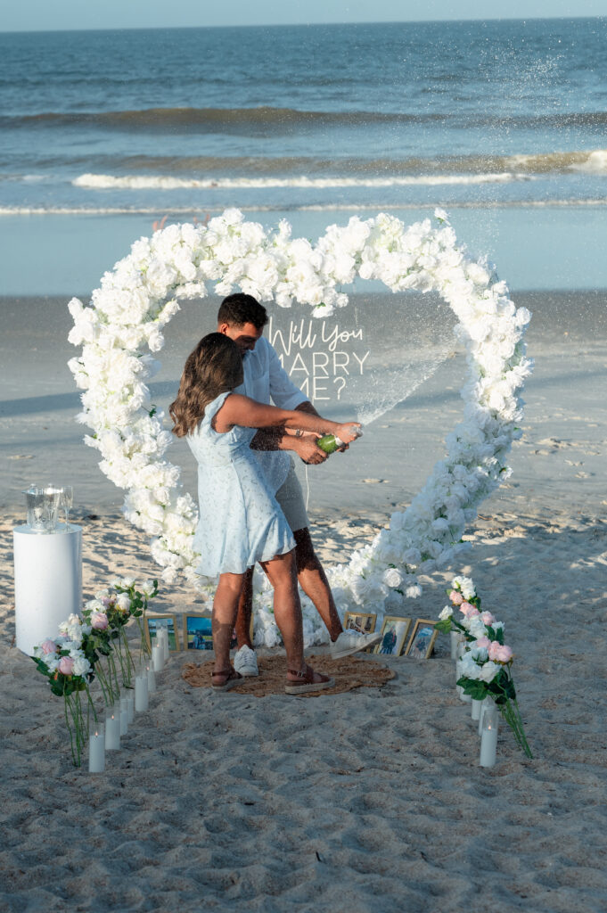 Romantic champagne toast setup at Ponte Vedra Beach proposal photography.