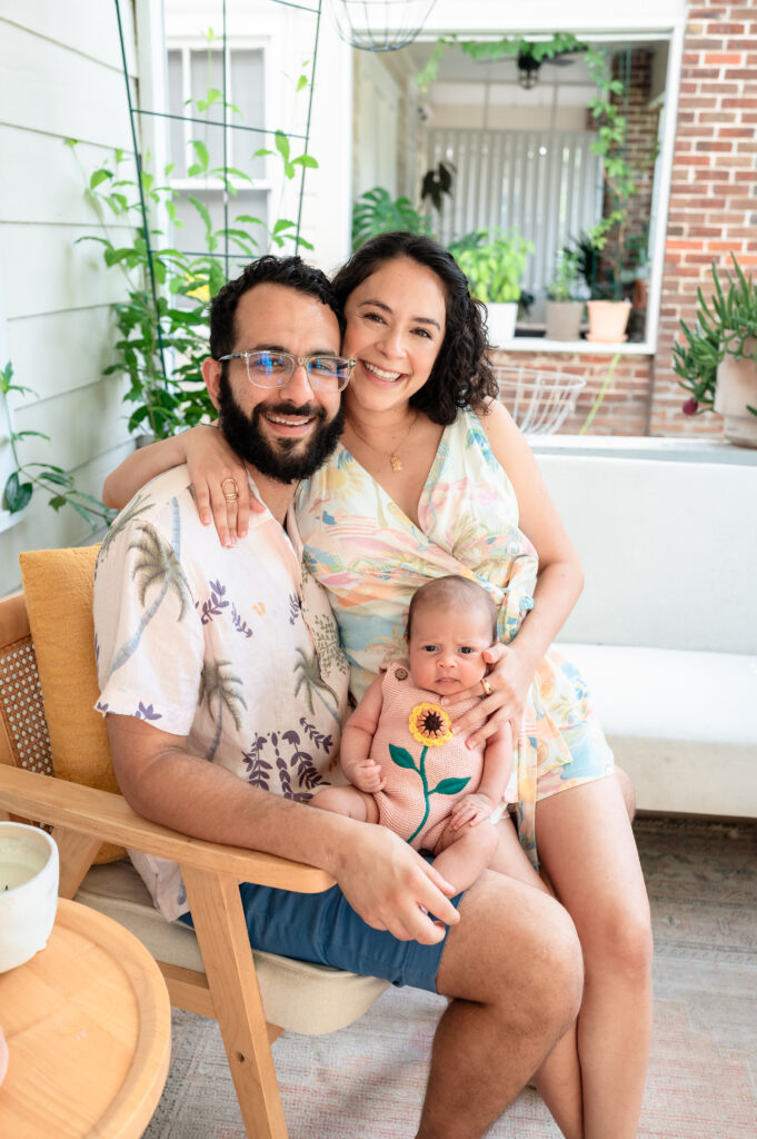 first-time parents cuddling newborn during lifestyle session