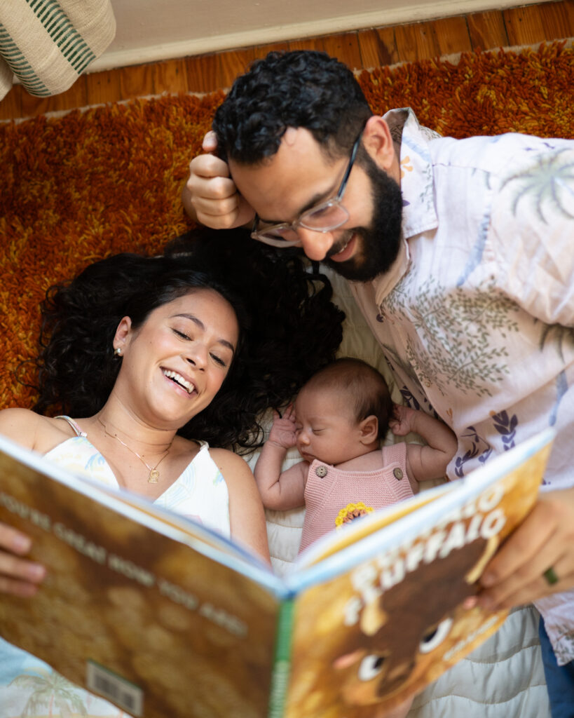 parents holding baby during in-home newborn session jacksonville