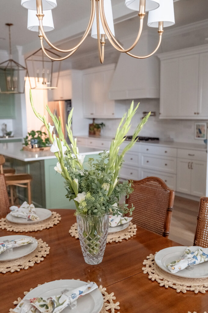 Warm brass accents and mint cabinetry photographed for interior design branding.