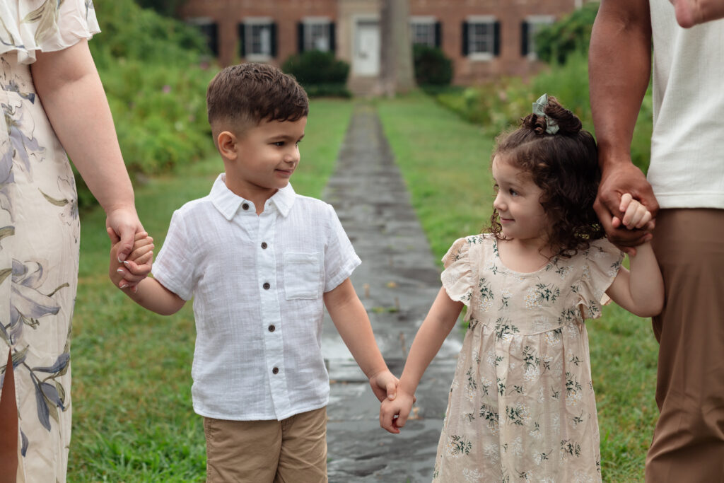 Parents holding kids hands during Fredericksburg family photography session