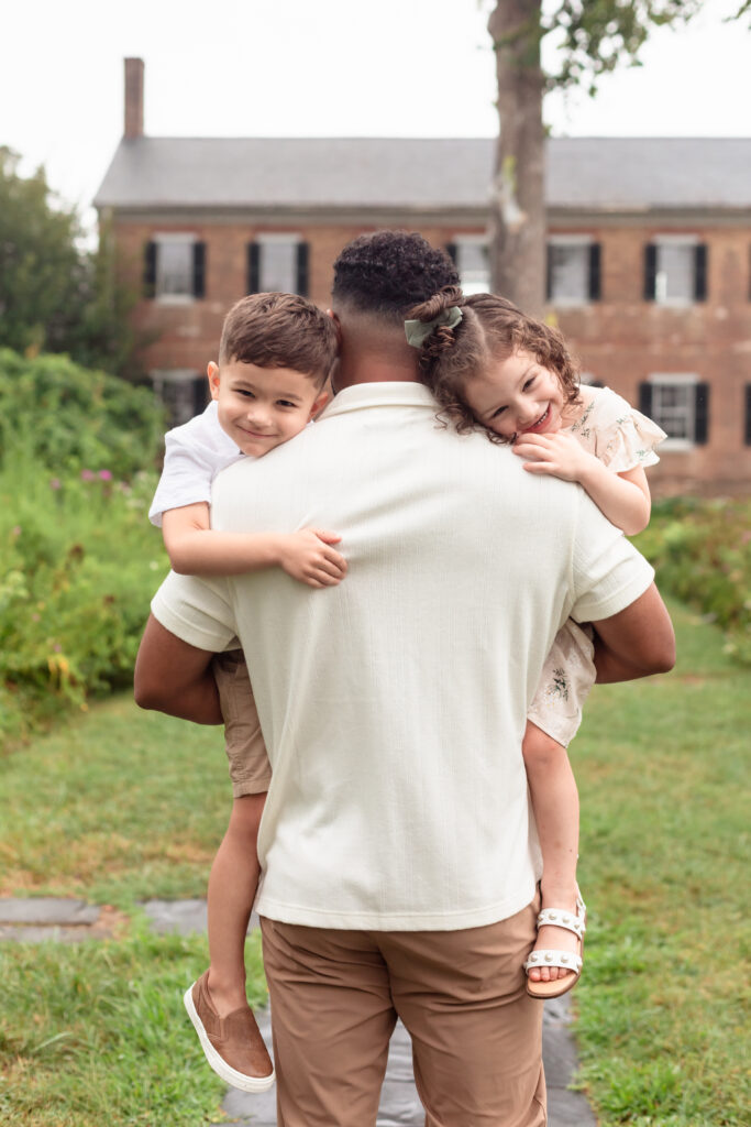 Dad hugging children during Virginia family photo session