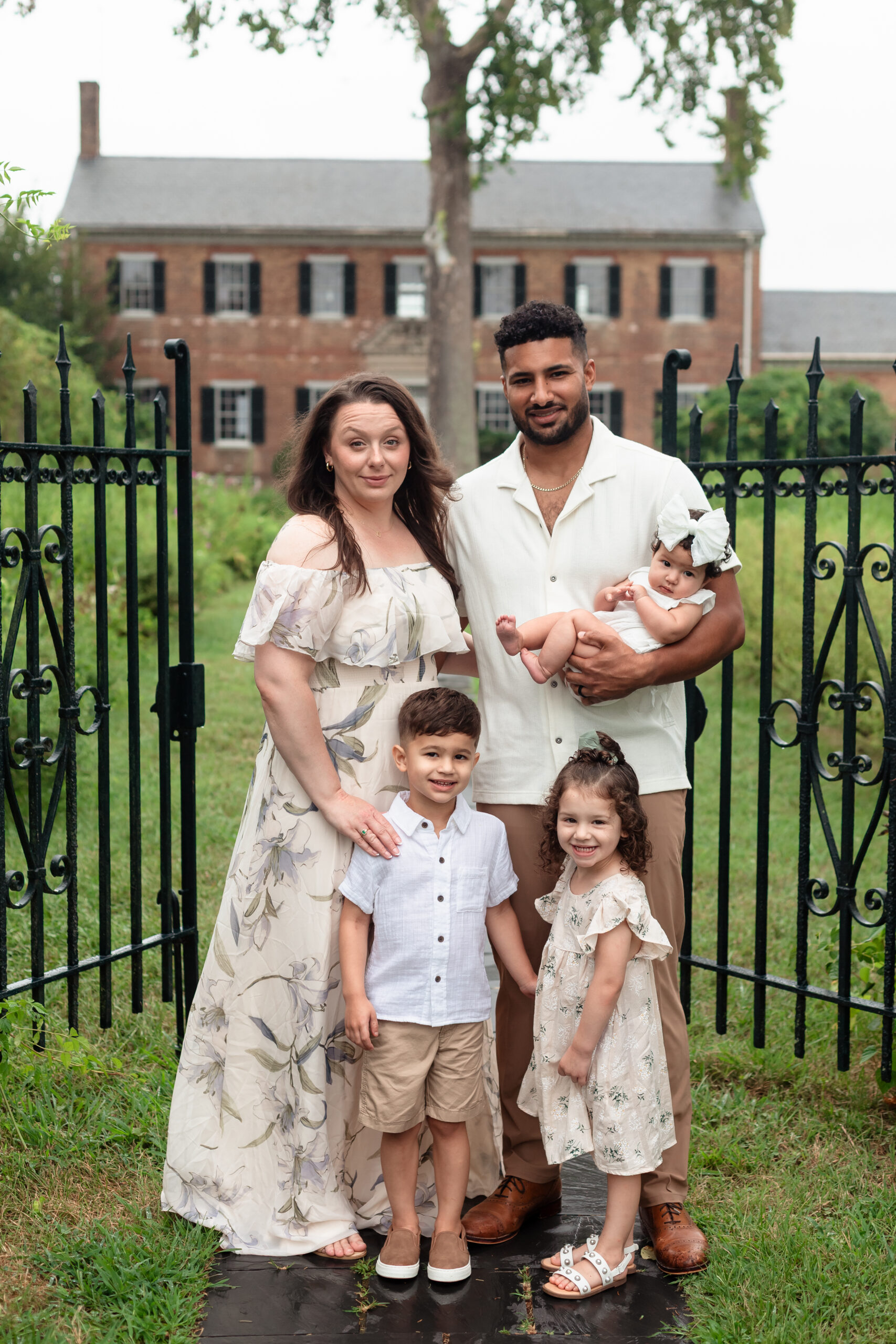 Richmond family photographer captures parents walking with children at Chatham Manor