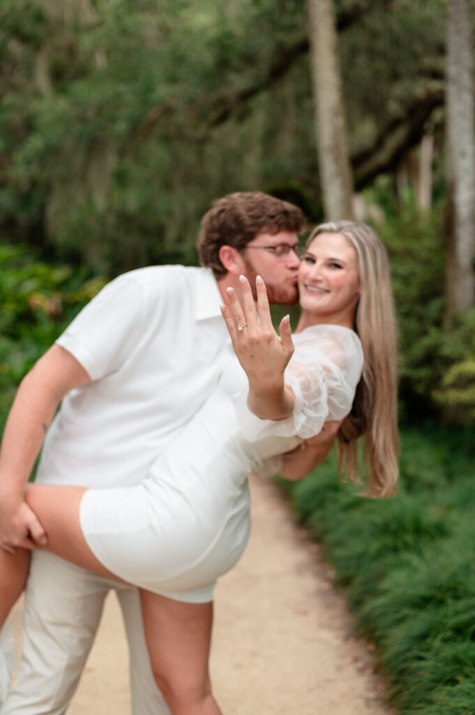 Brandon dipping Kristen for a playful kiss in the garden.