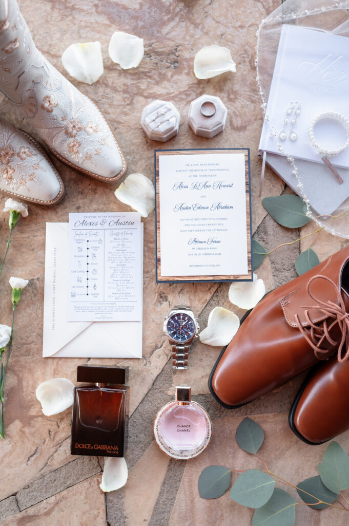 Bride’s wedding details flat lay including invitations and accessories photographed by EmmiClaire Photography