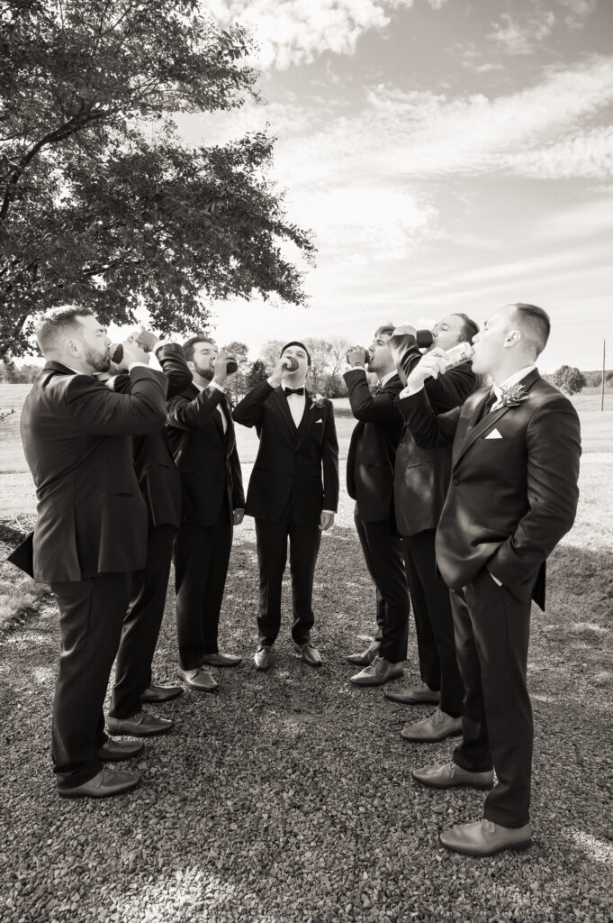 Groom and groomsmen candid photo before the ceremony with natural smiles and energy