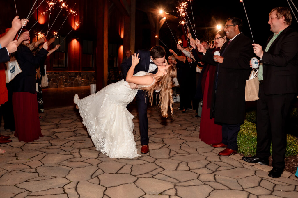 Final nighttime wedding portrait of the couple outdoors to end the day