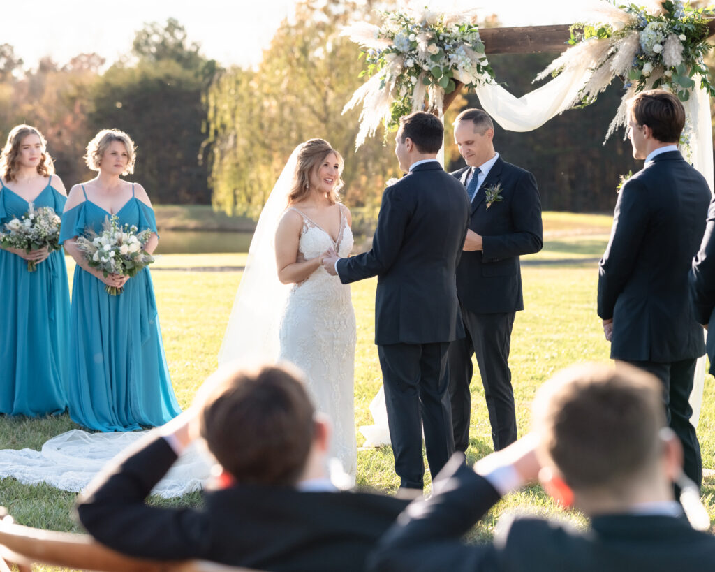 Wedding ceremony moment as the couple exchanges vows with emotional reactions from guests