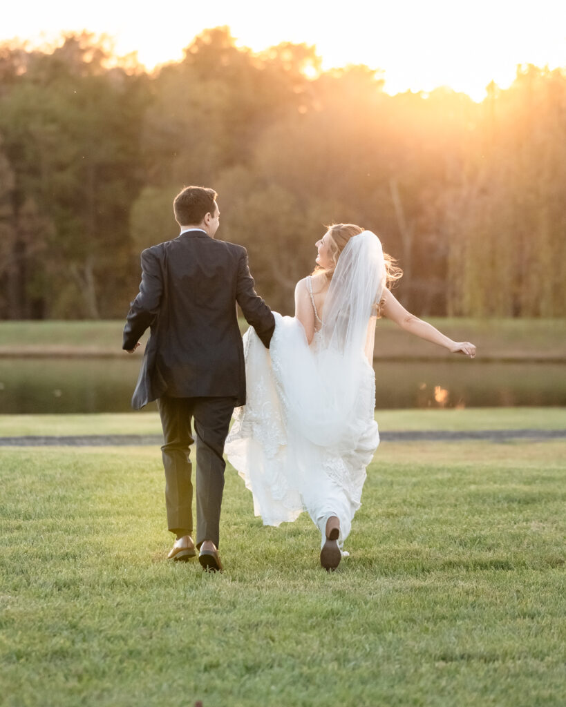 Bride and groom walking together outdoors at Atkinson Farms after the ceremony