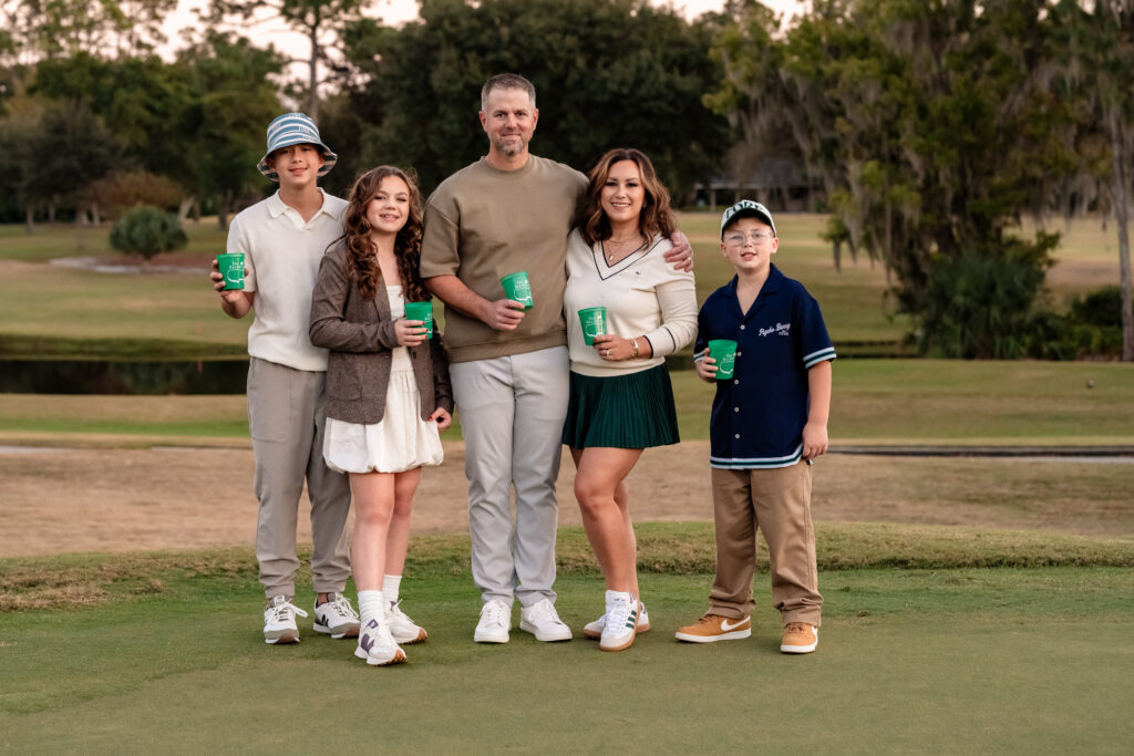 Sunset family portrait on the fairway at Deerwood Country Club