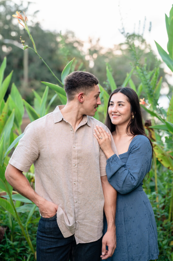 Engagement portraits beneath Spanish moss trees at Yacht Basin Park