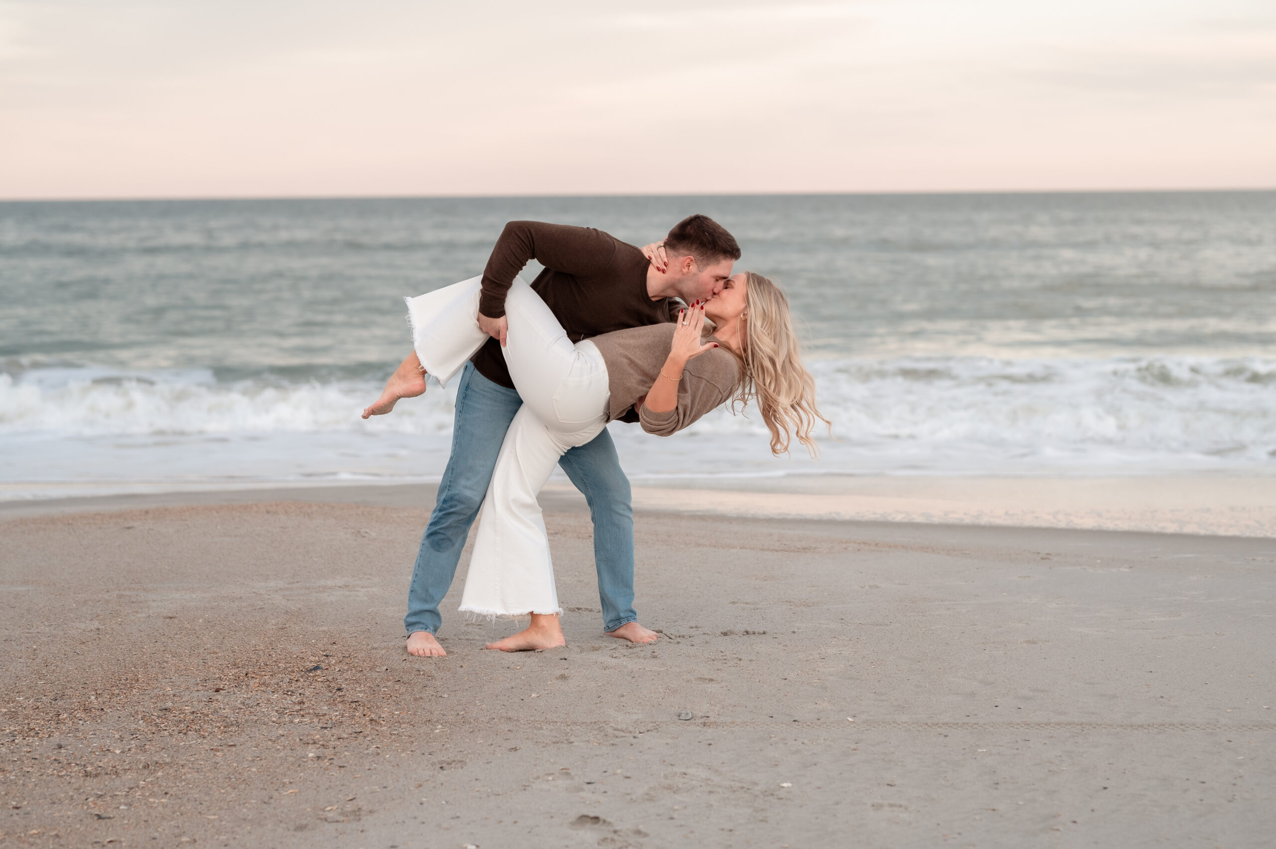Rachel showing off her engagement ring after the surprise proposal at Jacksonville Beach.