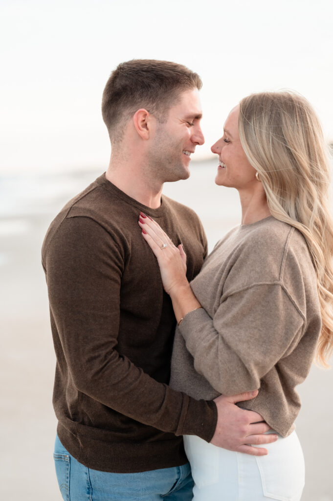 Close moment of Rachel and Chase celebrating their engagement on Jacksonville Beach.
