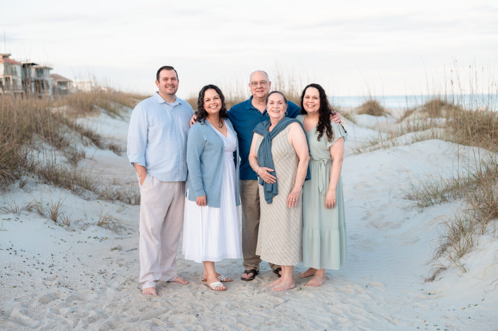 family hugging beach sunset portrait