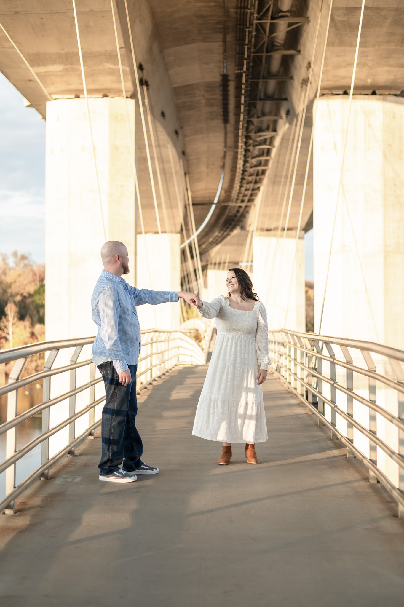couple holding hands james river engagement session richmond va