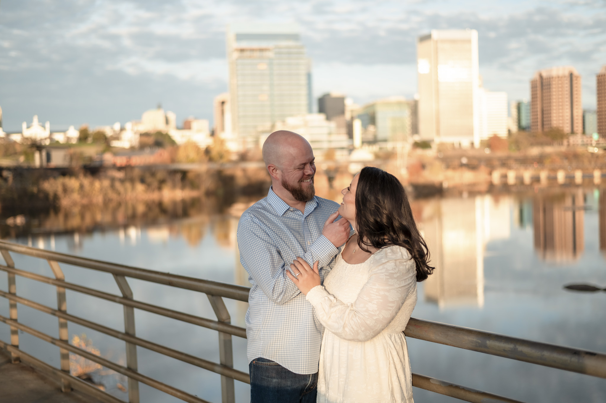 couple walking bridge belle isle engagement session richmond va
