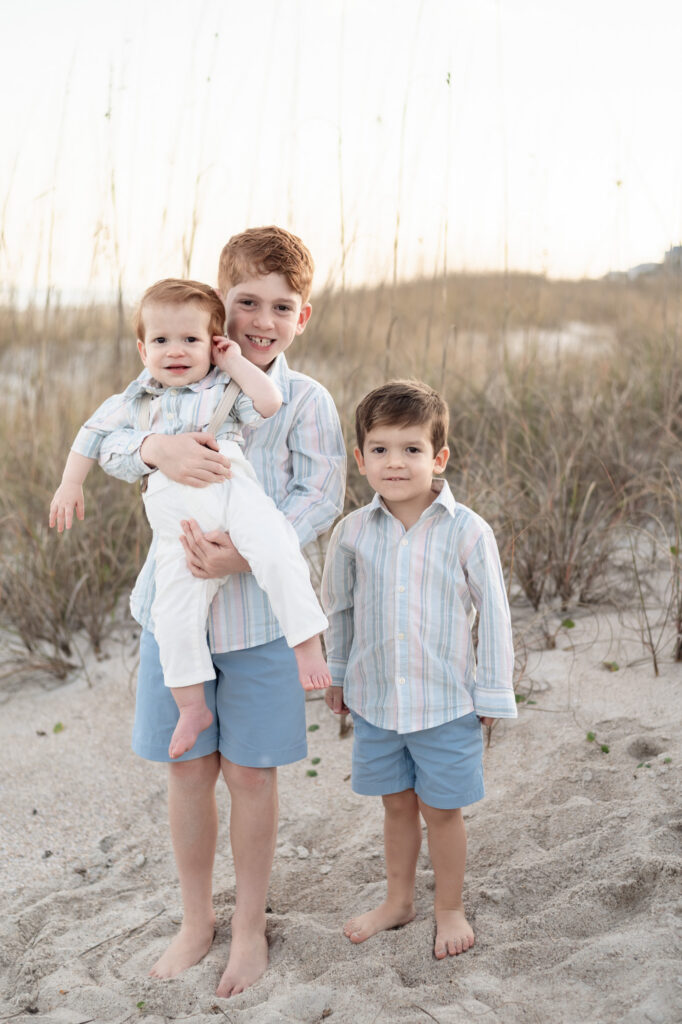 grandparents holding toddlers beach portrait Florida