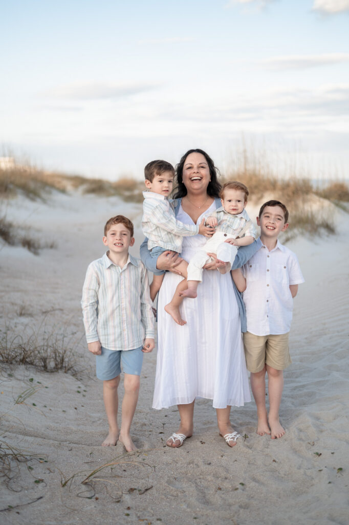grandparents surrounded by grandkids beach session