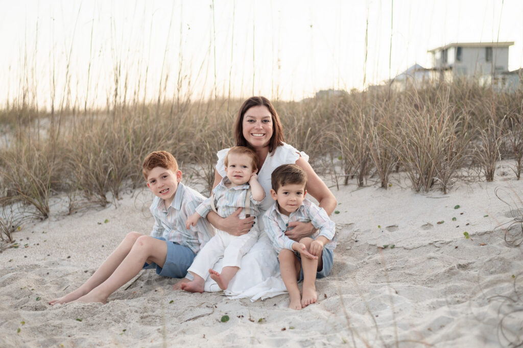 mother holding children sand dunes family photos