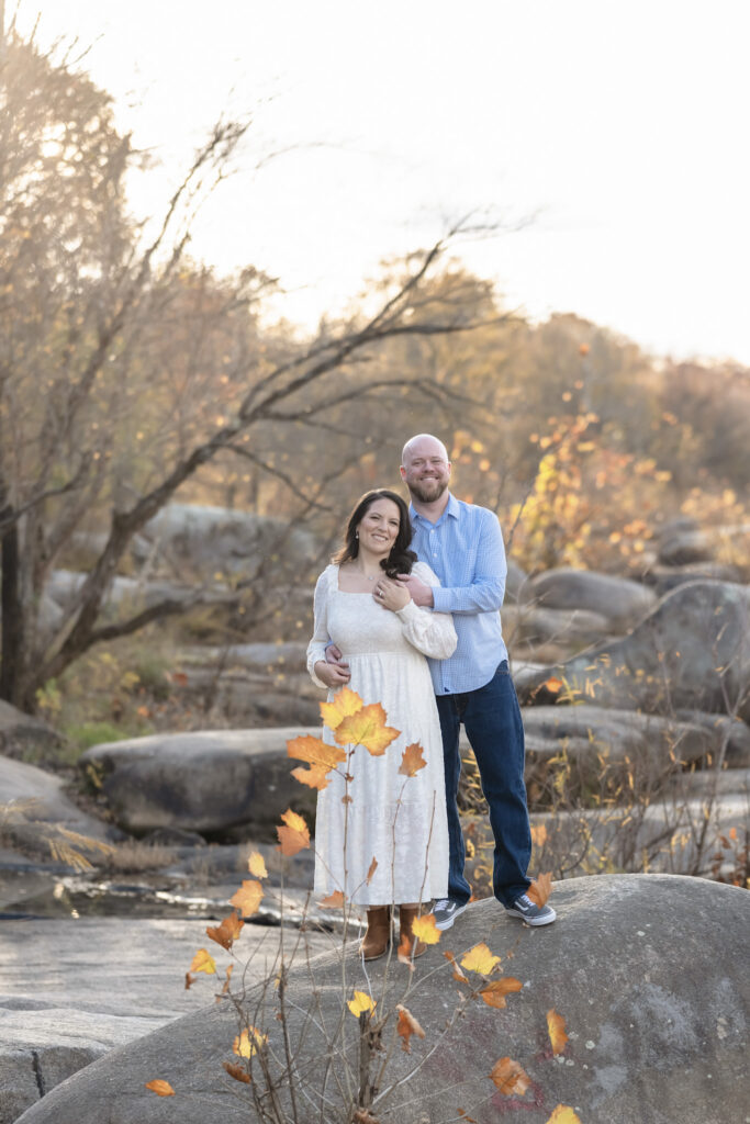 couple at belle isle engagement session richmond virginia skyline view