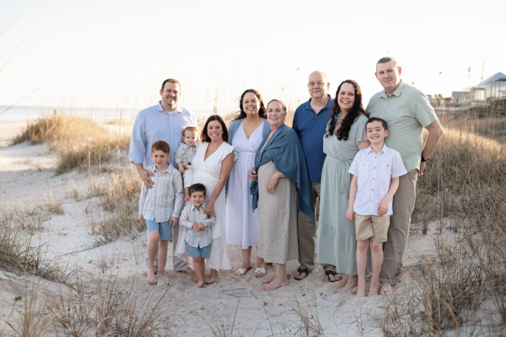 parents holding children beach candid moments