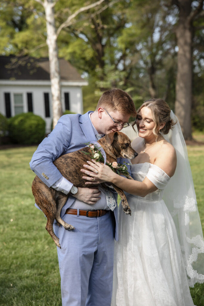 couple with dog during Richmond wedding portraits