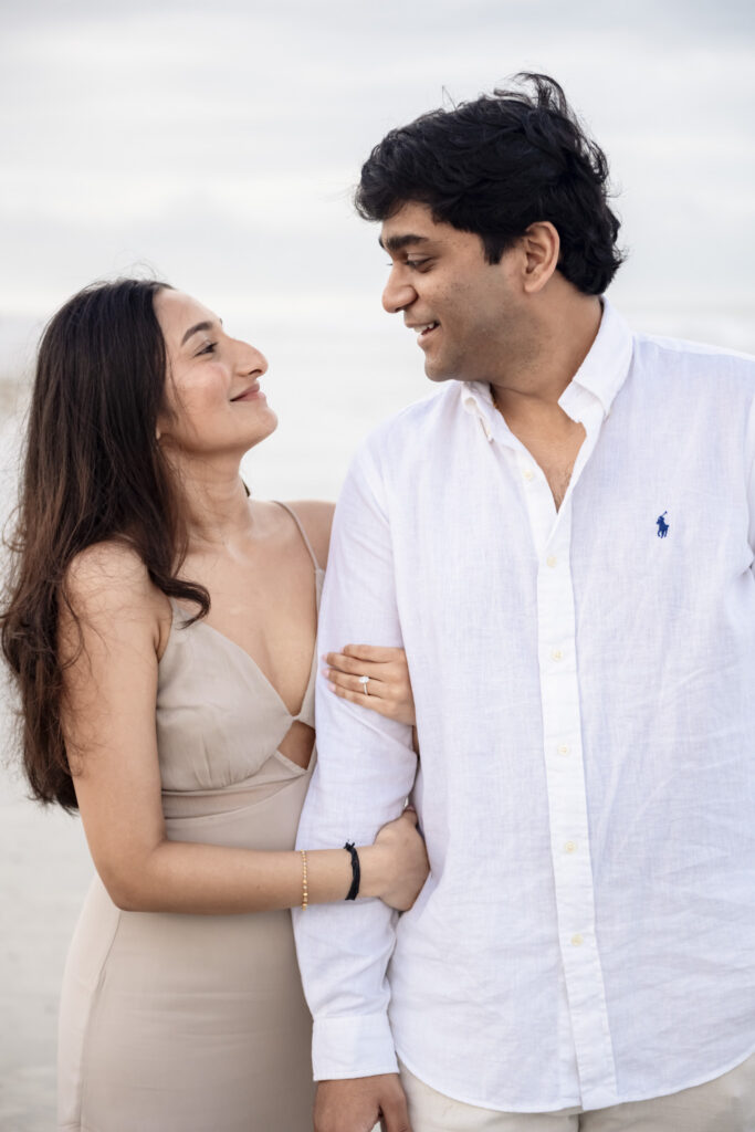 Romantic beach portraits after a surprise proposal.