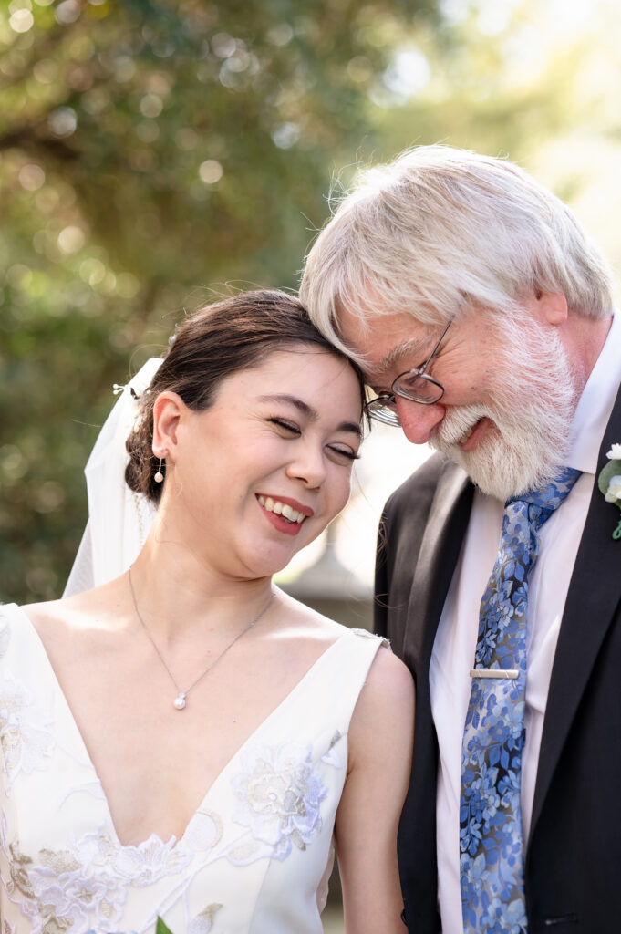 Bride sharing a special moment with her father before the ceremony.